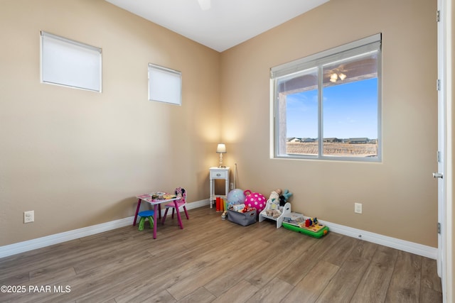 recreation room featuring light wood-type flooring