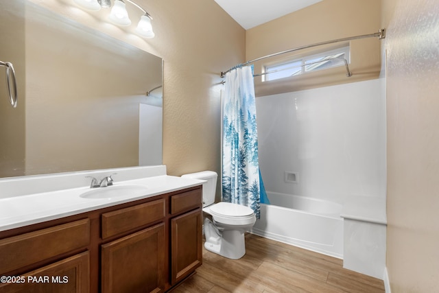 full bathroom featuring shower / bath combo with shower curtain, vanity, wood-type flooring, and toilet