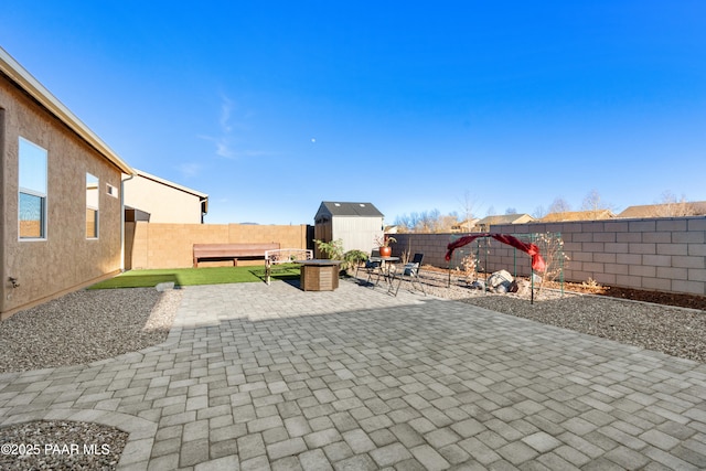 view of patio / terrace with a shed