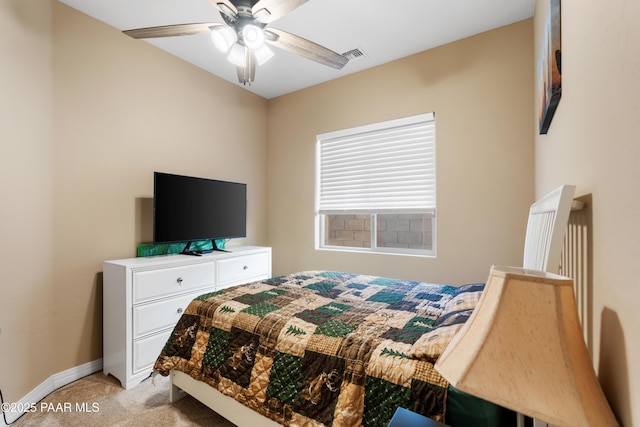 bedroom featuring ceiling fan and light colored carpet