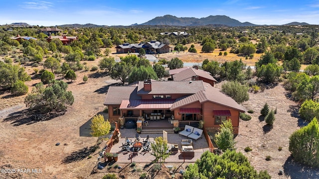 birds eye view of property with a mountain view