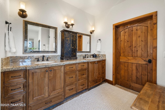 bathroom with double vanity and a sink