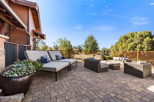 view of patio / terrace with outdoor lounge area and fence