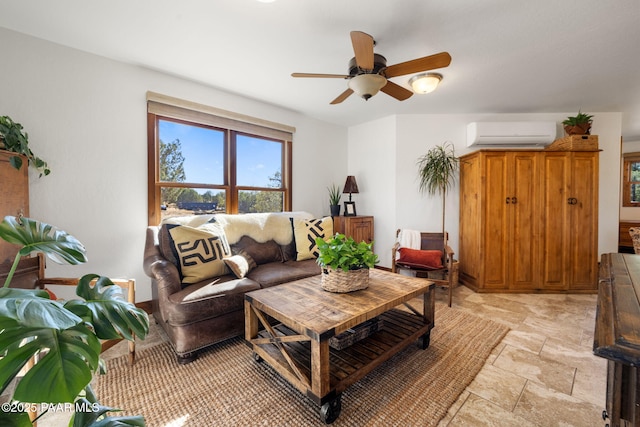 living area featuring stone finish floor, ceiling fan, and a wall unit AC