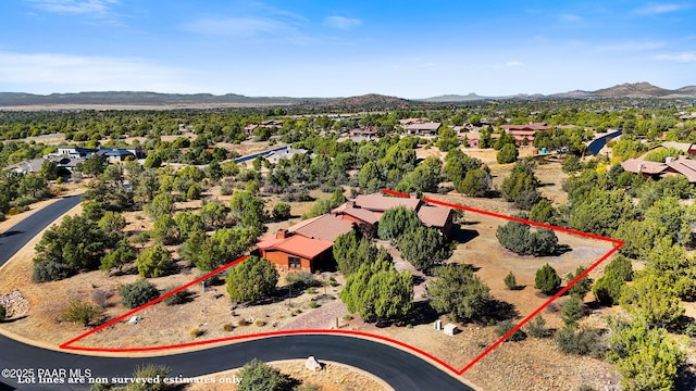 drone / aerial view featuring a mountain view