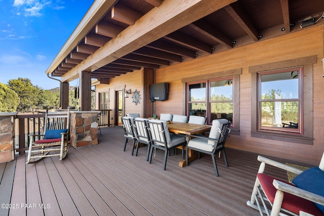 wooden terrace featuring outdoor dining space