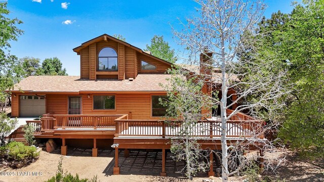 1893 Forest Vw, Prescott, AZ 86305 - view of front of home with a deck, an attached garage, roof with shingles, and a chimney