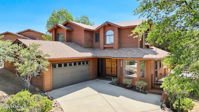 1893 Forest Vw, Prescott, AZ 86305 - view of front of house with an attached garage, roof with shingles, and concrete driveway