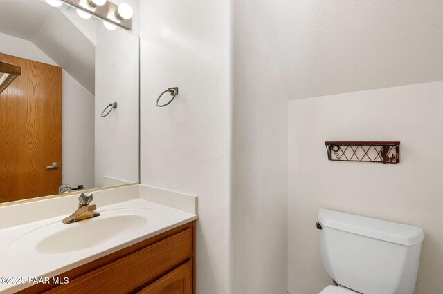 1893 Forest Vw, Prescott, AZ 86305 - bathroom featuring toilet, vaulted ceiling, and vanity