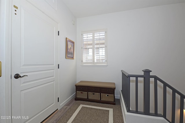 interior space with wood finished floors and baseboards