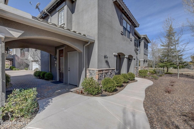 view of property exterior with stucco siding