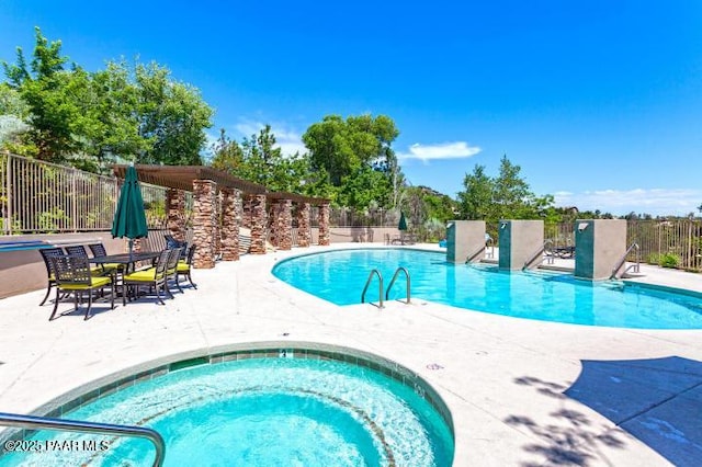 pool featuring a patio and fence