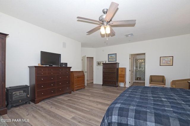 bedroom featuring visible vents, ceiling fan, and light wood-style floors