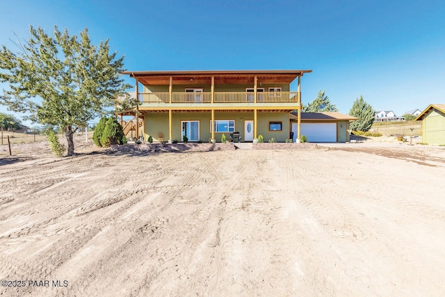 1245 N Windmill Way, Chino Valley, AZ 86323 - view of front property featuring a garage, driveway, and a deck
