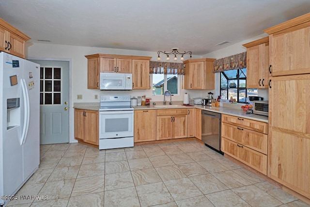 1245 N Windmill Way, Chino Valley, AZ 86323 - kitchen featuring appliances with stainless steel finishes, a sink, light countertops, and light brown cabinets