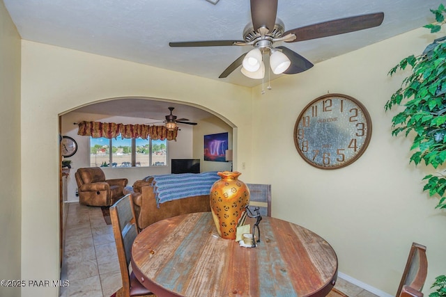 1245 N Windmill Way, Chino Valley, AZ 86323 - dining area with ceiling fan, baseboards, and arched walkways