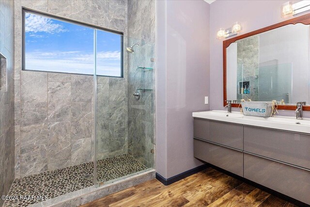 7420 E Reins Ct, Prescott Valley, AZ 86314 - bathroom with hardwood / wood-style floors, vanity, and a shower with shower door