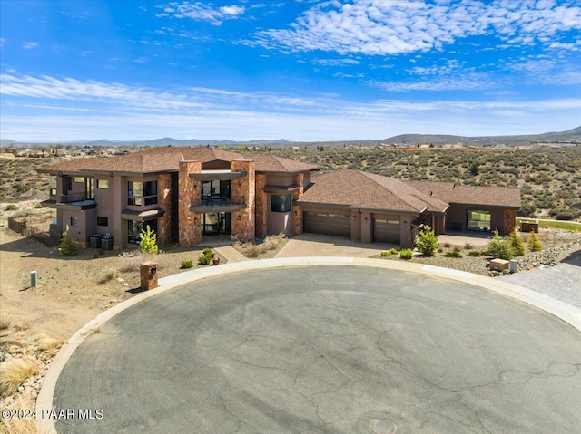 7420 E Reins Ct, Prescott Valley, AZ 86314 - view of front facade featuring a mountain view and a garage