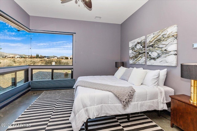 7420 E Reins Ct, Prescott Valley, AZ 86314 - bedroom with ceiling fan and concrete floors