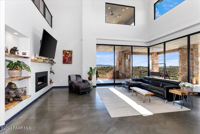 7420 E Reins Ct, Prescott Valley, AZ 86314 - living room featuring a high ceiling and plenty of natural light