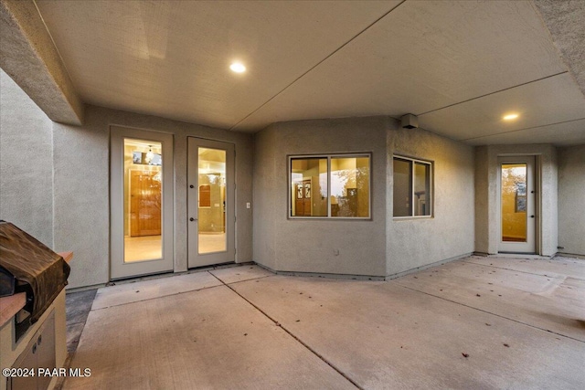 entrance to property featuring a patio