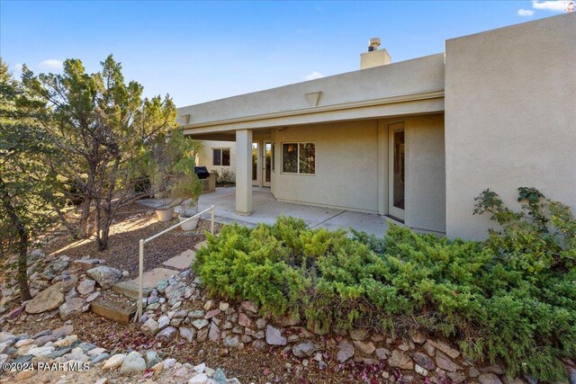 back of house featuring a patio