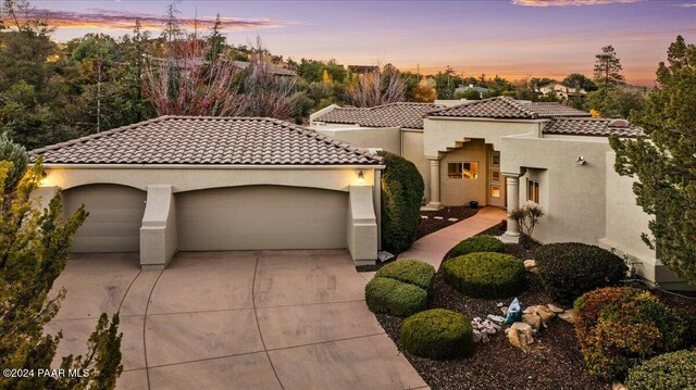 mediterranean / spanish-style house featuring a garage