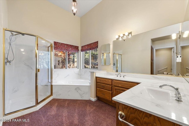 bathroom featuring vanity, separate shower and tub, and high vaulted ceiling