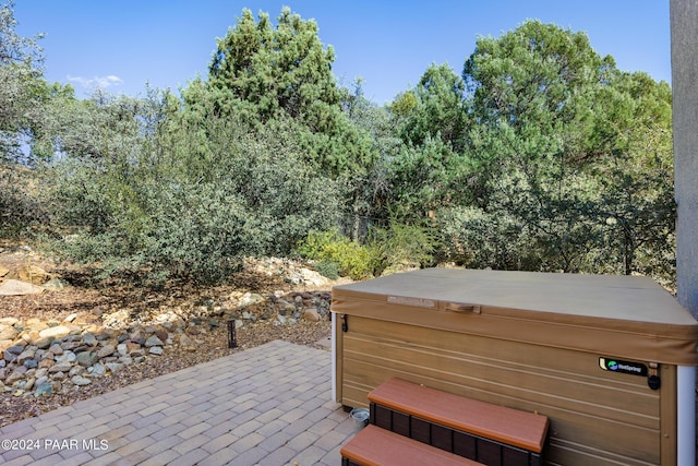 view of patio / terrace featuring a hot tub