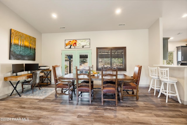 dining room featuring dark hardwood / wood-style flooring and french doors