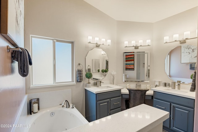 bathroom featuring vanity and a bathing tub