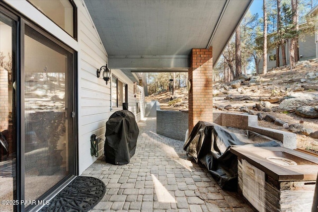 view of patio featuring a grill