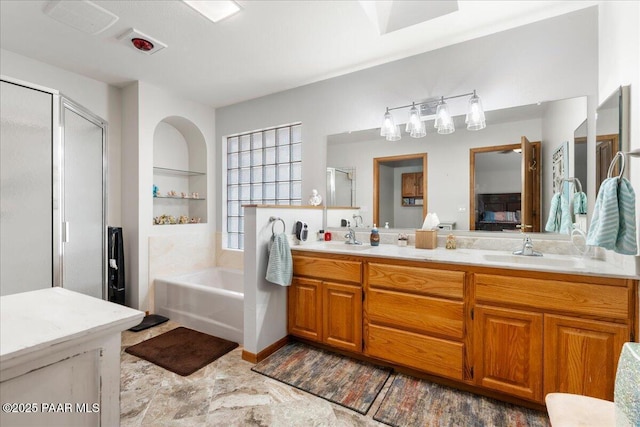 bathroom with plus walk in shower and vanity