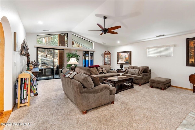 carpeted living room featuring vaulted ceiling and ceiling fan