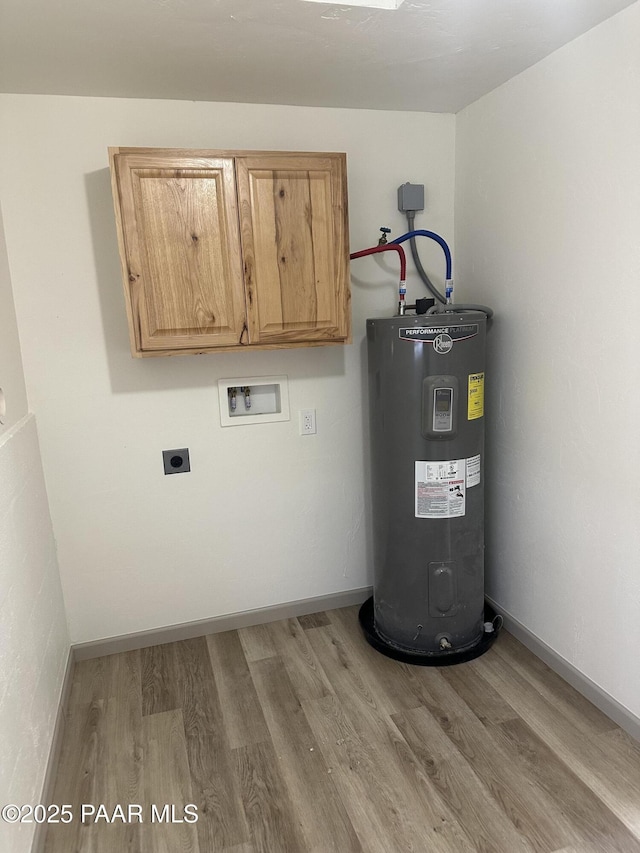 utility room featuring electric water heater