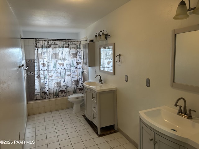 full bathroom with vanity, tile patterned flooring, tiled shower / bath combo, and toilet