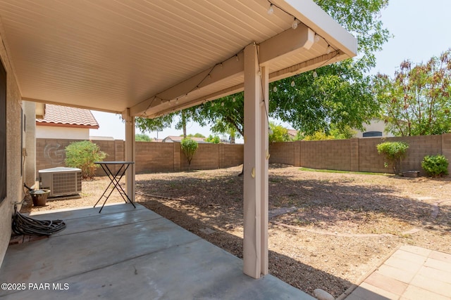 15306 W Eureka Trl, Surprise, AZ 85374 - fenced backyard featuring cooling unit and a patio