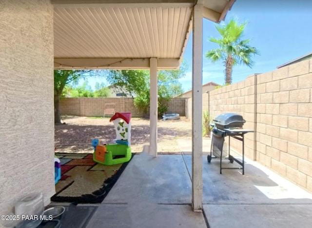 15306 W Eureka Trl, Surprise, AZ 85374 - fenced backyard featuring a patio and area for grilling
