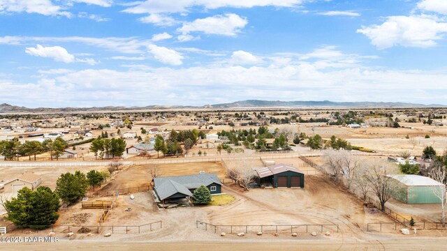 aerial view featuring view of desert and a mountain view