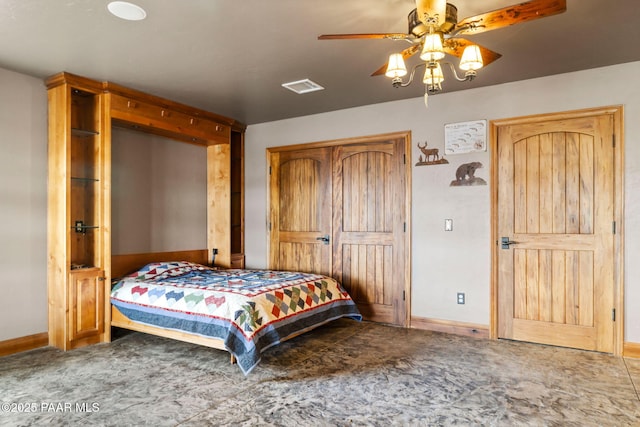 bedroom featuring visible vents and baseboards