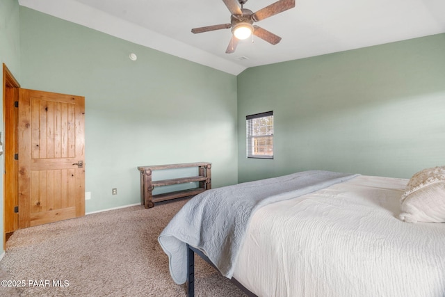 bedroom with vaulted ceiling, a ceiling fan, visible vents, and carpet floors