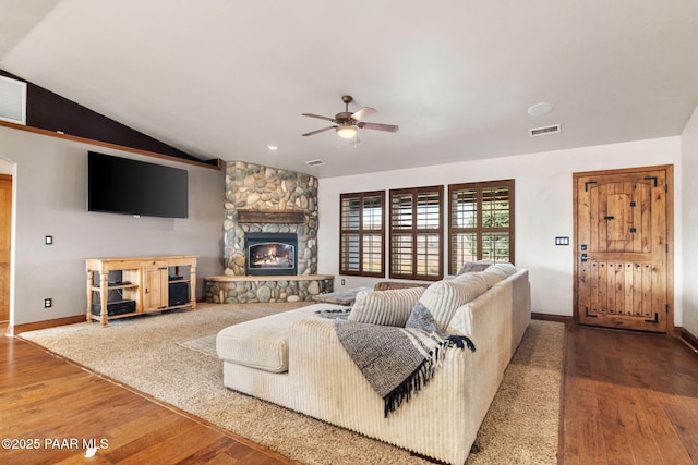 living room with visible vents, a ceiling fan, lofted ceiling, and wood finished floors