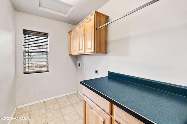 washroom featuring baseboards, attic access, hookup for a washing machine, cabinet space, and hookup for an electric dryer