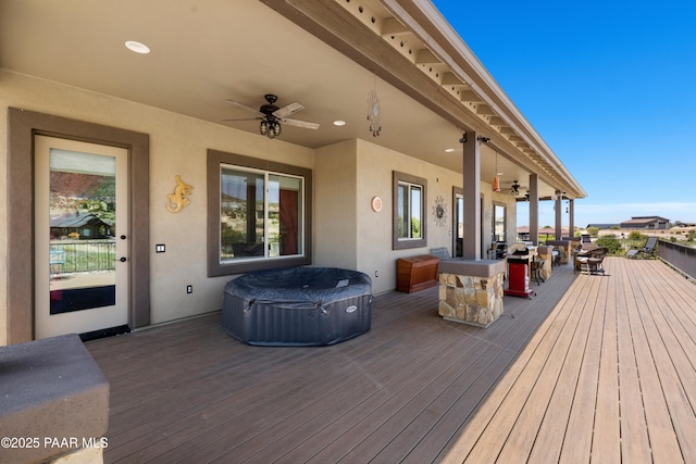 wooden terrace with a ceiling fan