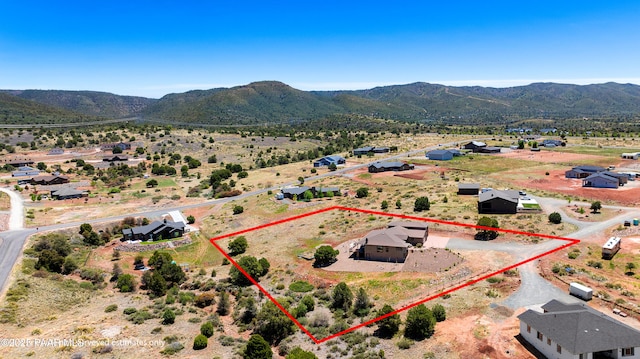 birds eye view of property with a rural view and a mountain view