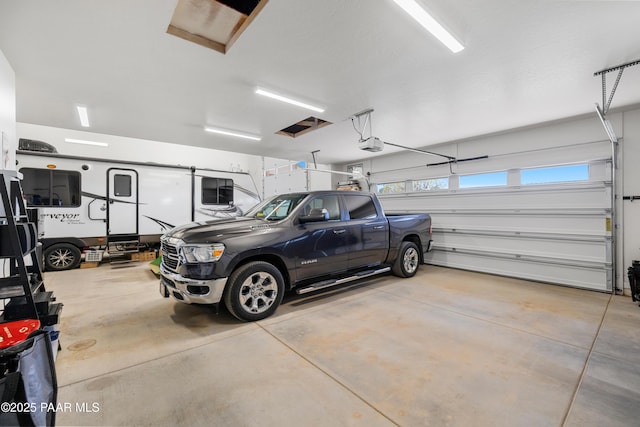 garage featuring a garage door opener