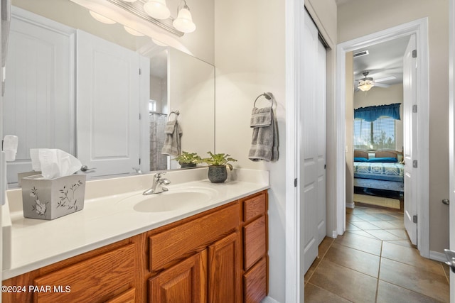 bathroom featuring vanity, visible vents, ceiling fan, tile patterned flooring, and ensuite bathroom