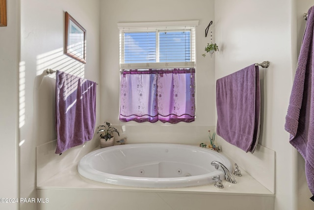 full bath with a whirlpool tub