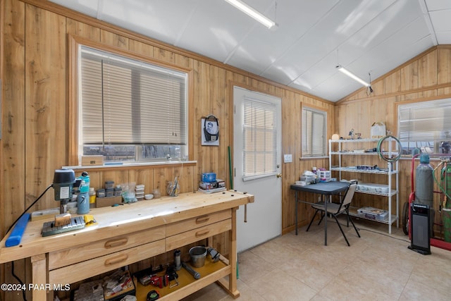 kitchen featuring wood walls, wood counters, and lofted ceiling