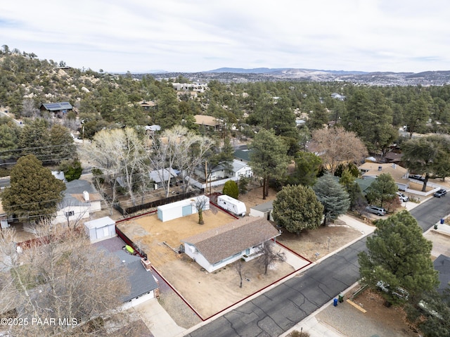 birds eye view of property with a mountain view